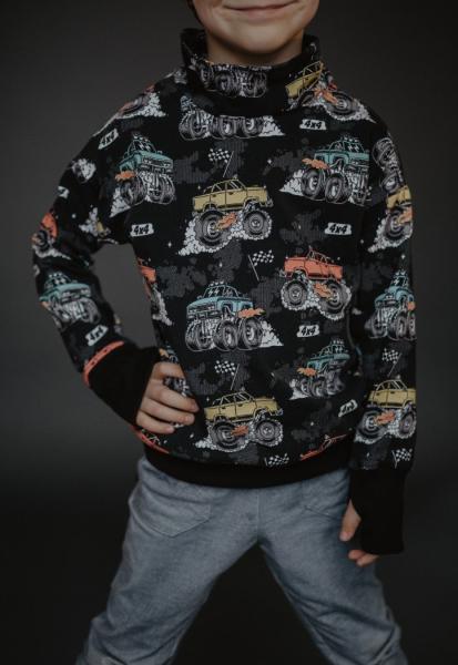 Baumwolljersey mit Monstertrucks auf Schwarz